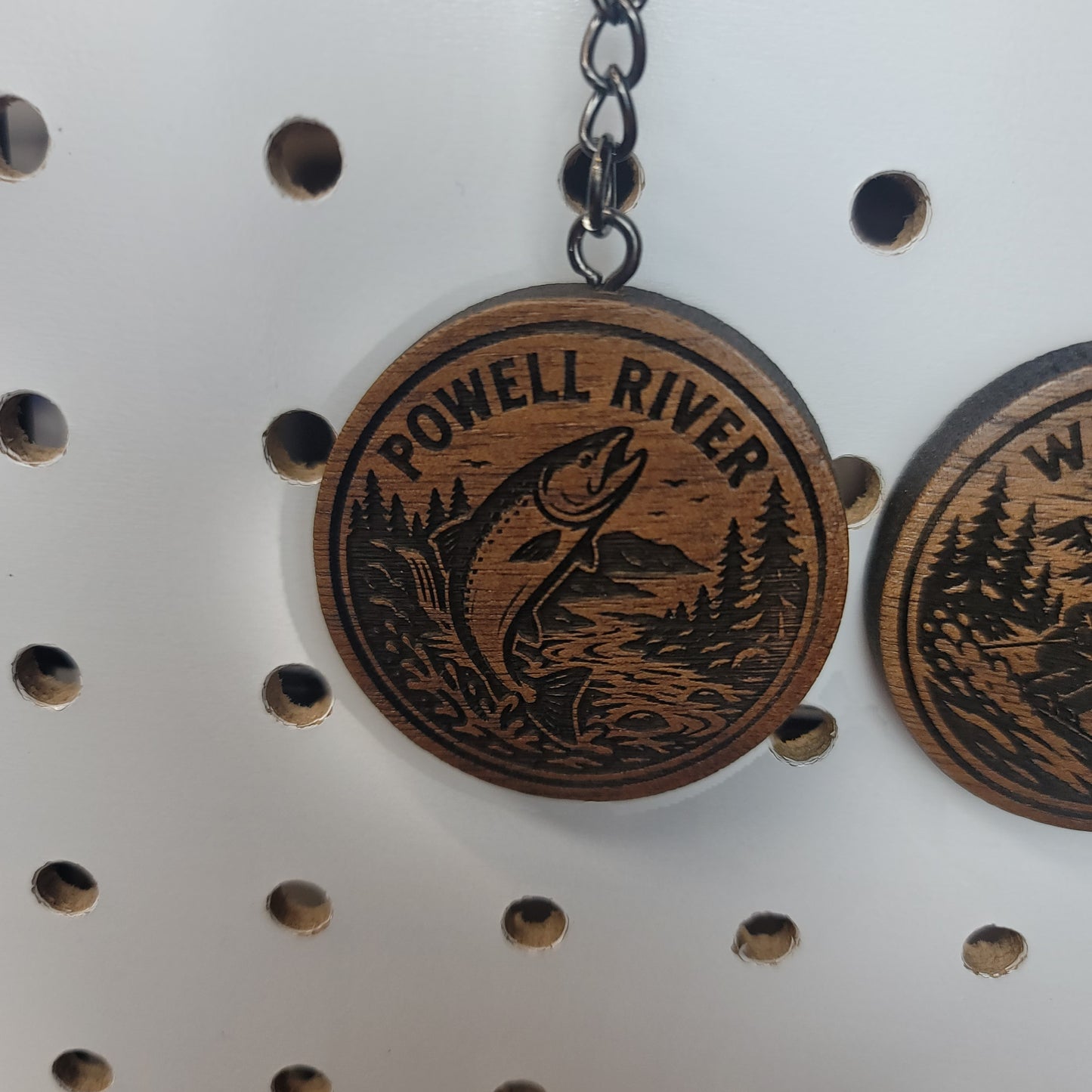 Walnut keychain that says powell river